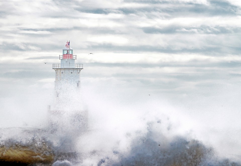 Lighthouse Through the Surf Spray